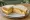 Omelette Sandwich: an illustration of egg, butter and pepper on white bread.