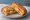 Omlet Sandviç: an illustration of egg, tomato and cheese on bread.
