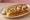 Oyster Roll: an illustration of oyster, tartar sauce, lemon and lettuce on hot dog bun.