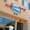 Stucco storefront with a red and blue "Mediterranean Wraps of Palo Alto" sign above the window and open doorway.