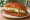 Pambazo de Milanesa: an illustration of katsu, lettuce, queso fresco and sour cream.