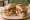 Pan Bagnat: an illustration of tuna, egg, tomato, onion and more.