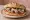 Pan Bagnat Traditionnel: an illustration of tuna, anchovy, egg, tomato and more.