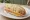 Pancho con Chucrut: an illustration of sausage and sauerkraut on hot dog bun.