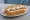 Pancho con Mayonesa: an illustration of sausage and mayonnaise on hot dog bun.