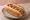 Pancho Doble: an illustration of sausage on hot dog bun.