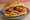 Pane con le Panelle e Crocchè: an illustration of chickpeas on bread.