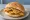 Pane con le Panelle: an illustration of chickpeas on bread.
