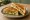 Paneer Sandwich: an illustration of cucumber, tomato and onion on white bread.