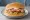 Paninaro Style: an illustration of ham and cheese on burger bun.
