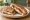 Panini with Mozzarella and Tomato: an illustration of mozzarella, tomato and basil on ciabatta.