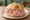 Panino Bolognese: an illustration of mortadella on kaiser roll.