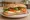 Panino Caprese: an illustration of mozzarella, tomato, basil and olive oil on ciabatta.