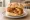 Panino con Arancina/Arancino: an illustration of rice, pork and tomato on kaiser roll.
