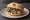 Panino con Bollito Misto Piemontese: an illustration of beef and salsa verde on kaiser roll.