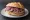 Panino con Brovada: an illustration of pork on rye bread.