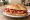Panino con Capocollo Calabrese: an illustration of pork, capicola and pepper on kaiser roll.