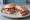 Panino con Capocollo Toscano: an illustration of pork and capicola.