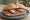 Panino con Coglioni di Mulo: an illustration of pork and salami on bread.
