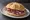 Panino con Corallina Romana: an illustration of pork and salami on kaiser roll.