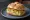 Panino con Frittata: an illustration of egg, onion and potato on kaiser roll.