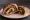 Panino con Gubana: an illustration of walnuts and raisins.