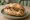 Panino con Hauswurst: an illustration of pork and sausage on bread.