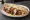 Panino con Kebab: an illustration of beef, lettuce, tomato, onion and more.