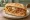 Panino con Maccheroncini di Campofilone: an illustration of beef and egg on bread.