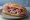 Panino con Musetto: an illustration of pork and sausage on bread.
