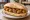 Panino con Olive Ascolane: an illustration of beef, pork and olives on bread.