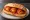 Panino con Pallotte Cacio e Ova: an illustration of egg, cheese and tomato on bread.