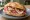 Panino con Pancetta Piacentina: an illustration of pork on bread.