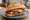 Panino con Parmigiana: an illustration of eggplant, mozzarella, tomato and basil on bread.