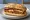 Panino con Parmigiana di Melanzane: an illustration of eggplant, mozzarella, tomato and basil on bread.