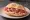 Panino con Prosciutto di Parma: an illustration of pork and prosciutto on kaiser roll.