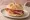 Panino con Prosciutto di Sauris: an illustration of pork and prosciutto on kaiser roll.