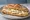 Panino con Ricotta Salata: an illustration of ricotta, olive oil and pepper on bread.