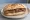 Panino con Salsiccia Sarda: an illustration of sausage, pork and pepper on bread.