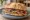 Panino con Saltimbocca: an illustration of veal, prosciutto, butter and pepper on kaiser roll.