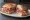 Panino con Salumi di Norcia: an illustration of prosciutto, salami, pork and pepper on bread.