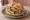 Panino con Sarde in Saor: an illustration of sardine, onion, vinegar, raisins and more on kaiser roll.