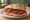 Panino con Slinzega: an illustration of beef, pepper and olive oil on bread.