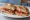 Panino con Soppressata Calabrese: an illustration of salami, pork and pepper on bread.