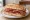 Panino con Soppressata Lucana: an illustration of salami, pork and pepper on bread.