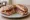 Panino con Speck di Sauris: an illustration of speck, pork and pepper on bread.