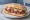 Panino con Tartare di Manzo: an illustration of beef, olive oil, pepper, lemon and more on ciabatta.