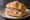 Panino con Tonno di Favignana: an illustration of tuna and olive oil on kaiser roll.