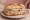 Panino con Vitello Tonnato: an illustration of veal, tuna, mayonnaise, caper and more on bread.