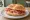 Panino: an illustration of pork on kaiser roll.